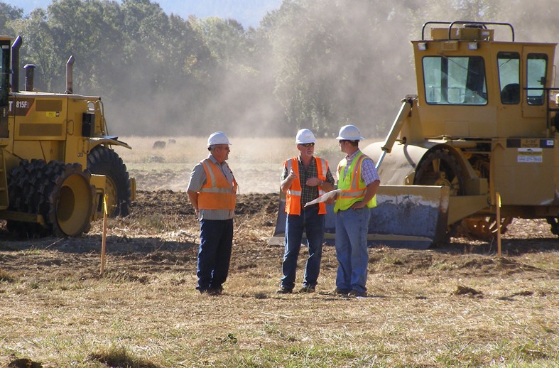 Engineers and contractor communicating during wastewater treatment plant expansion, Willits, CA
