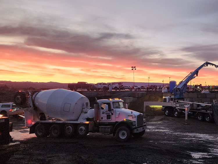 Concrete was poured in 150 cubic yard sections, with each concrete truck delivering approximately 10 cubic yards.