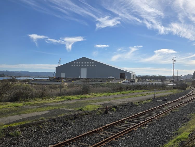 Finished pellet storage warehouse in 2025, with building access ramps that are near but not within the 100-year floodplain.