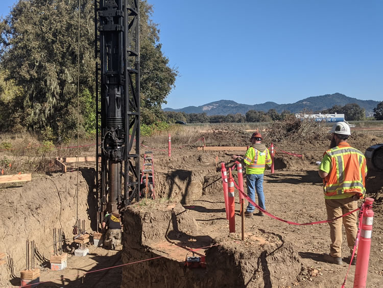 SHN geologists observing the pile driving for the bridge.
