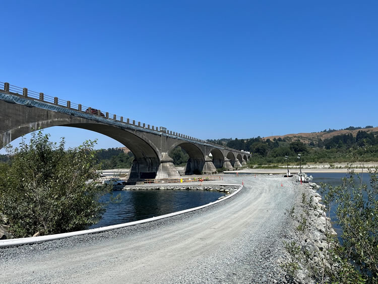 Temporary road constructed within the Eel River to access Pier 2 for repair.
