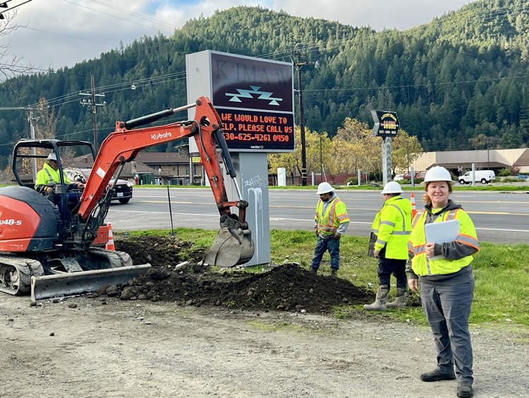 Biology team member monitoring active construction for environmental compliance.