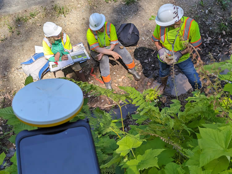 The biology team discussing the mapping of the wetlands within the study area with the use of FieldMaps software and high-accuracy Trimble GPS.