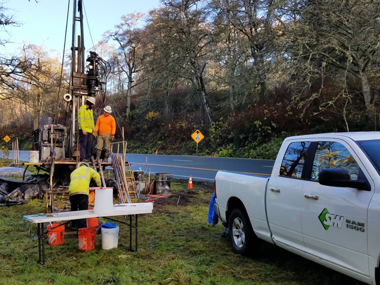 Drilling for geotechnical investigation along Highway 101 for Last Chance Grade.