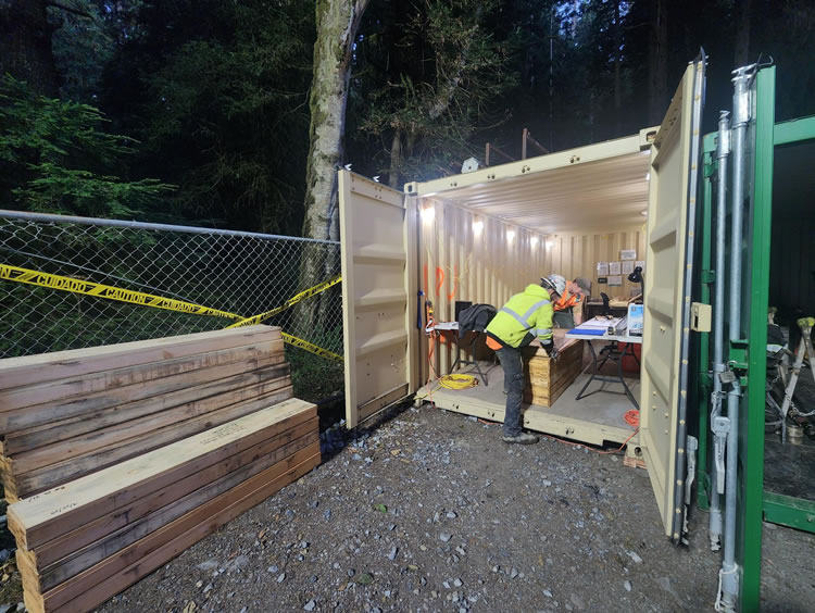 Shipping container lab and office where geologists log boring cores and document drilling progress.