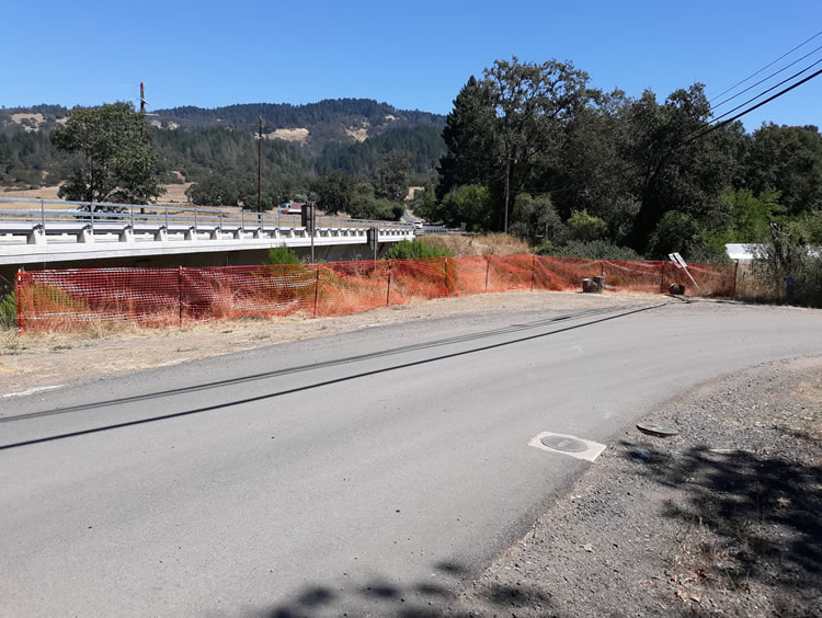 Davis Creek bridge. SHN installed protective fencing to prevent vehicles from running over mitigation vegetation planted along the edge on southwest quarter of project area.