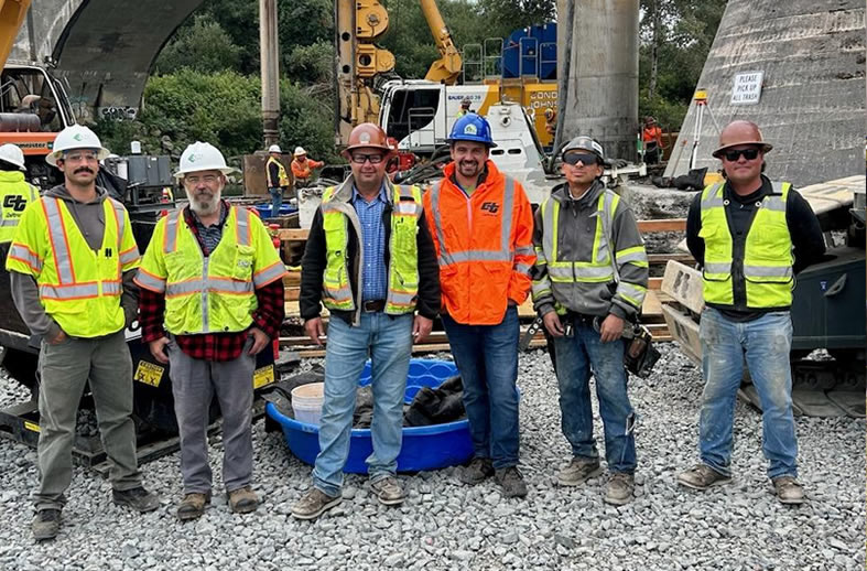 Environmental engineers Jacob Aguilara (far left) and Peter Dunn (second from left) at the conclusion of emergency repairs to the Ferndale Bridge, Humboldt County, California.