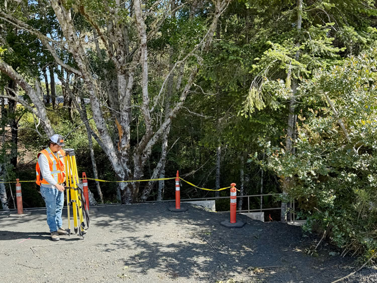 Surveying the construction layout in June 2025.